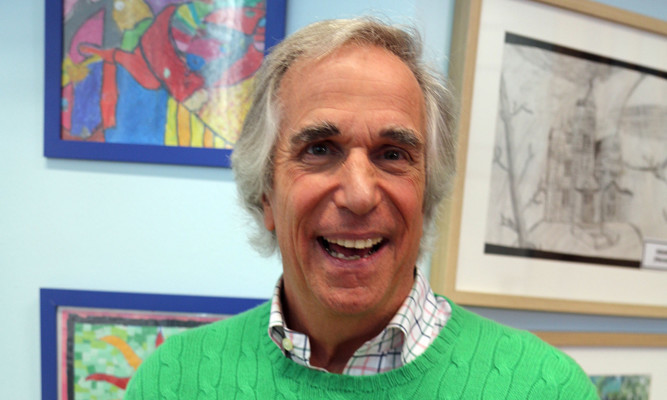 Henry Winkler after he was given a gold Blue Peter badge.