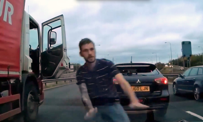 The moment the trucker left his lorry to confront the motorist.