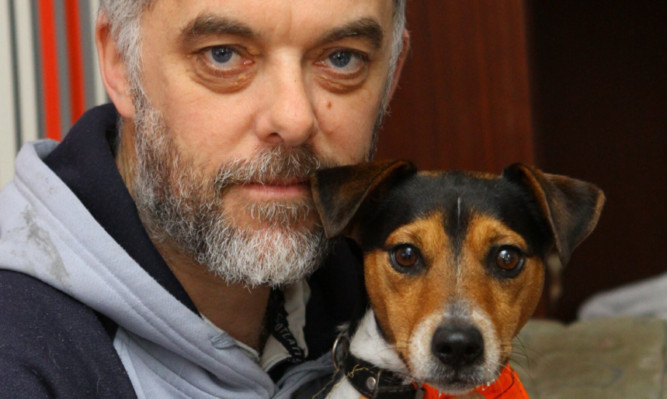 Miracle recovery  Ollie with his owner, Ian Farquhar.