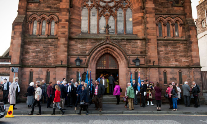 The congregation outside the church after the memorial service.