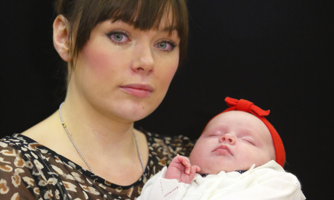 Rachael MacColl, with baby daughter Eriskay, is flying out to the United Arab Emirates in her search for missing husband Timmy.