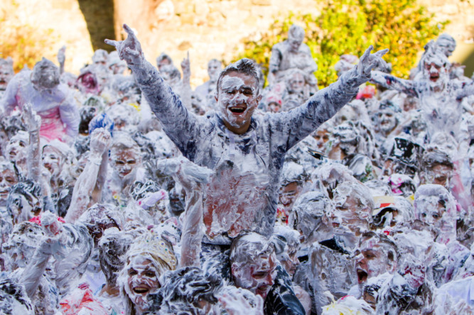 Students gathered in St Andrews Universitys Lower College Lawn for the traditional Raisin Monday foam fight.