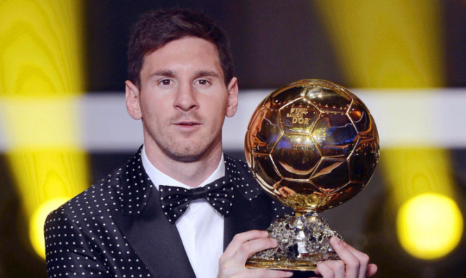 Messi with the Ballon d'Or trophy.