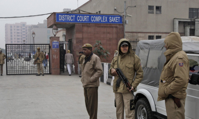 Indian police officers on guard outside the court in New Delhi.