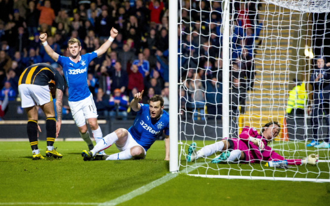 Rangers striker Jon Daly (centre) celebrates after scoring his side's opening goal of the game