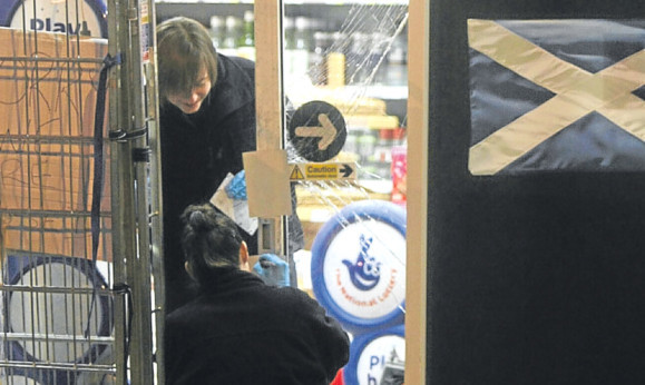 Scenes of crime officers at the Co-Op.