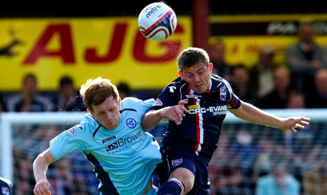 Liam Craig (left) challenges Brittain during the September clash.