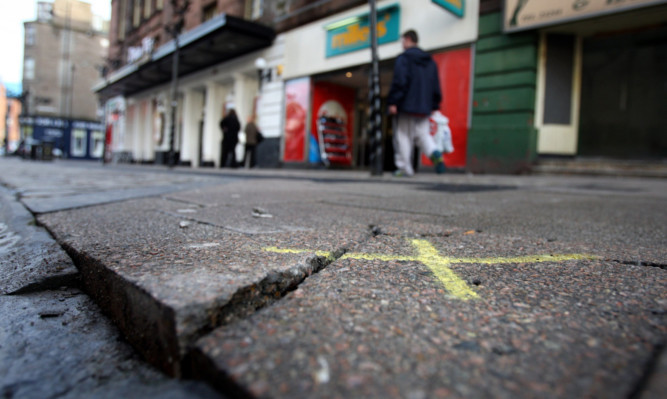 Broken and raised slabs on the Cowgate.