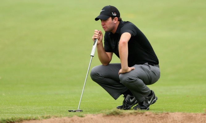 Scott Jamieson lines up a putt during the first round.