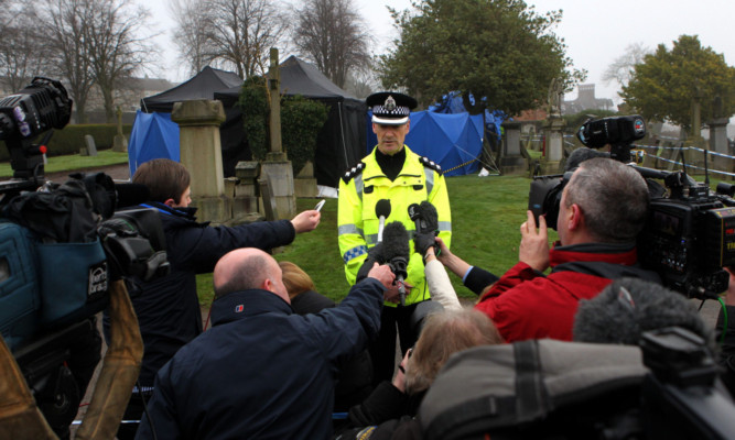 Chief Inspector Kenny Macleod speaks to the media at Old Monkland Cemetery.