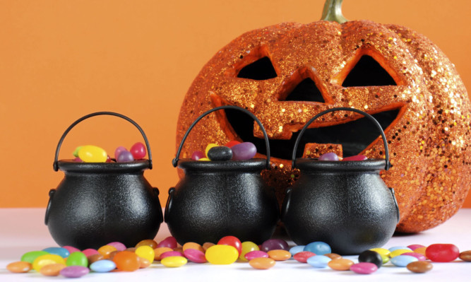 Hallowe'en cauldrons filled with sweets. Could too much make kids fat?