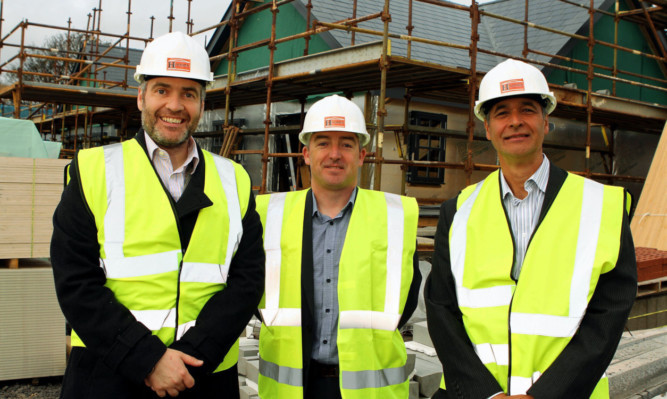 At the old Camus House site, from left: Councillor Donald Morrison, Stephen Lynas from Hadden Construction and John Morrow from Angus Council housing department.