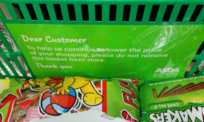 Asda makes its message to customers very clear with warning signs on its baskets.