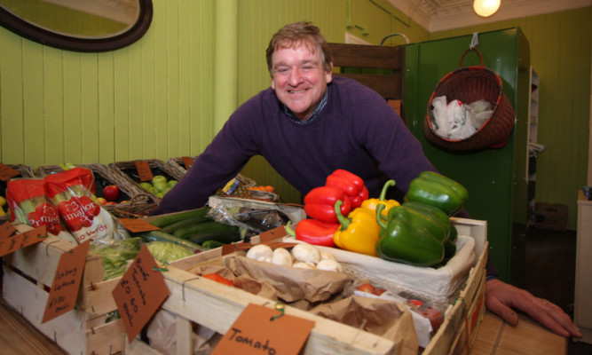 A delighted Bill Bowles in his relocated shop.