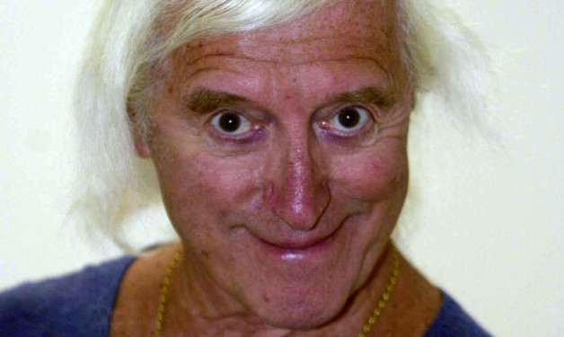 File photo dated 15/08/2000 of Sir Jimmy Savile, as two hospitals described their shock at fresh allegations against the TV presenter which suggested he preyed on children during visits to wards as part of his catalogue of abuse. PRESS ASSOCIATION Photo. Issue date: Thursday October 11, 2012. Claims have emerged that Savile groped young patients at Stoke Mandeville Hospital in Buckinghamshire, where he worked as a volunteer fundraiser, while one woman has claimed she saw him molest a brain-damaged hospital patient at Leeds General Hospital. See PA story POLICE Savile. Photo credit should read: Fiona Hanson/PA Wire