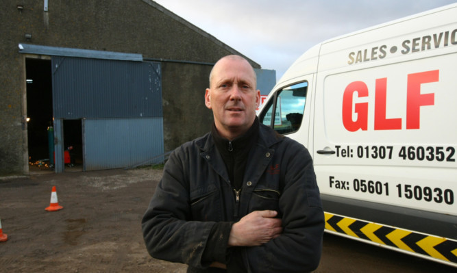 Mr Fleming outside his workshop.