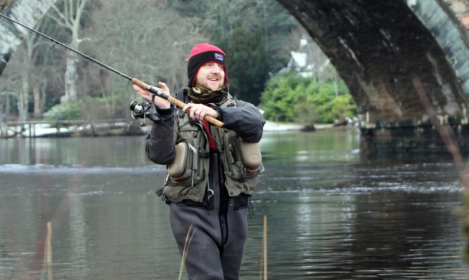 Iain McLaren, the first angler to land a fish at the opening of the Tay salmon season on Tuesday.