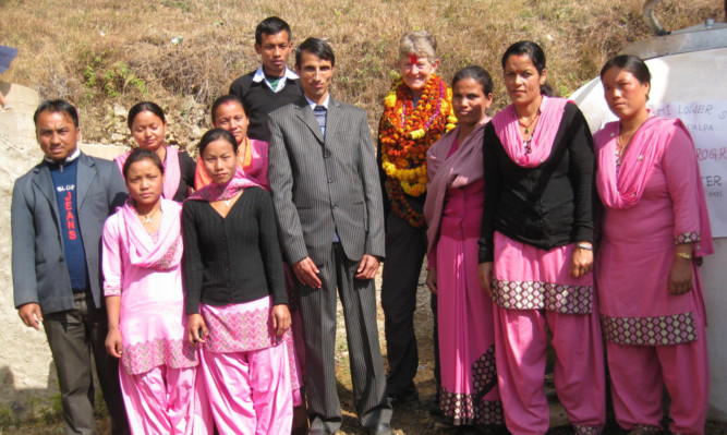 Jackie Taylor with the staff of Mayshyam School.