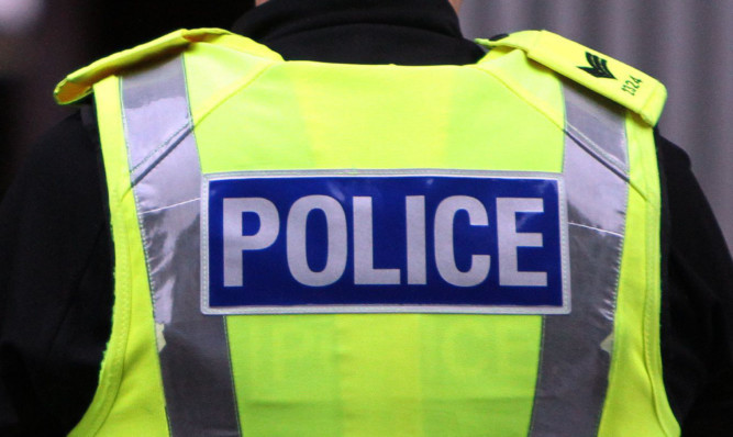 Kris Miller, Courier, 24/05/14. Picture today shows police activity on Lochee Road, Dundee where it is reported a woman jumped from a top floor (4th storey) flat.