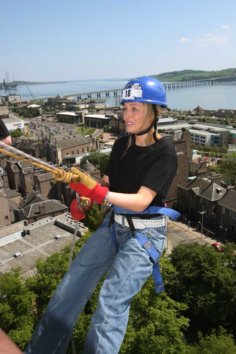DOUGIE NICOLSON, COURIER, 22/05/10, NEWS.

DATE - Saturday 22nd May 2010.

LOCATION - University of Dundee, Tower Block.

EVENT - Charity abseil for Maggies Centre.

INFO - Nicky Flynn looks relaxed(!) at the top of the tower, from the 'Falling Angels' team from Ward 32 at Ninewells Hospital.

STORY BY - Reporters.