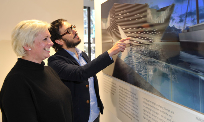 Lynn Algar and Maurizio Mucciola view the new design.