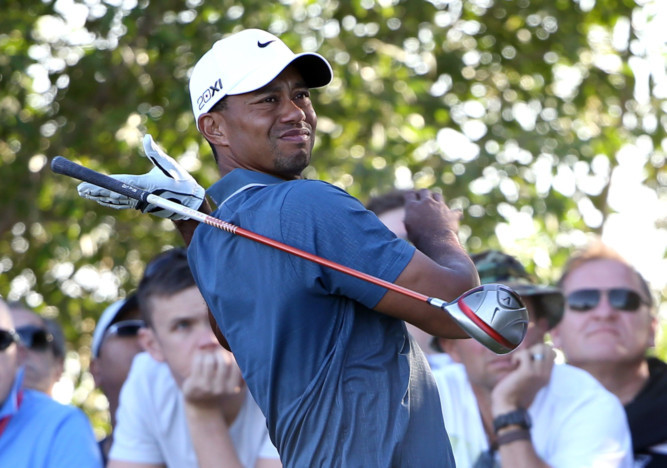 Tiger Woods lets another drive slip off line.
