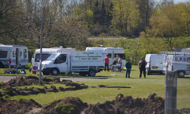 Travellers camping on a private site in Glenrothes in April.