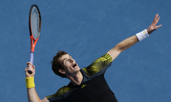 Andy Murray serves during his match against Gilles Simon.