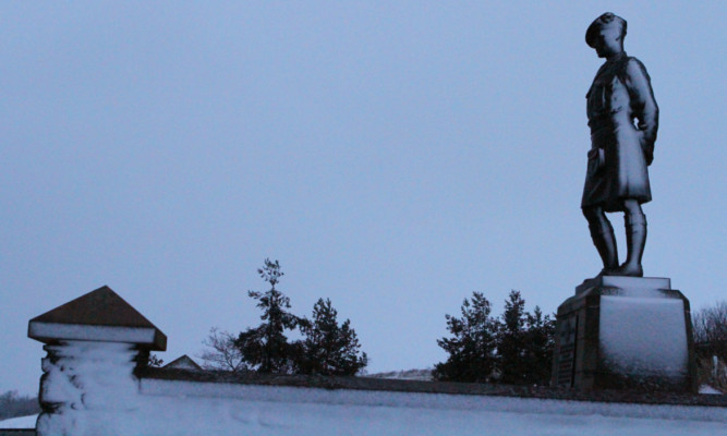 The soldier at the Black Watch memorial at Powrie Brae, north of Dundee, stands resolute in the snow.