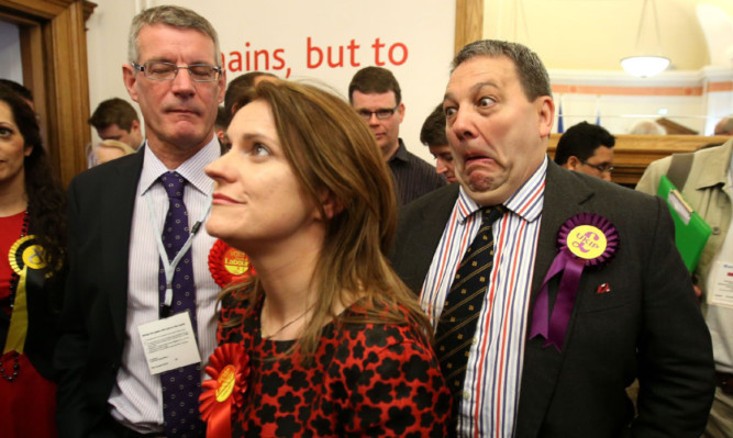 Catherine Stihler waits for the European election results to be announced in Edinburgh this year as UKIP MEP David Coburn pulls a face in the background.