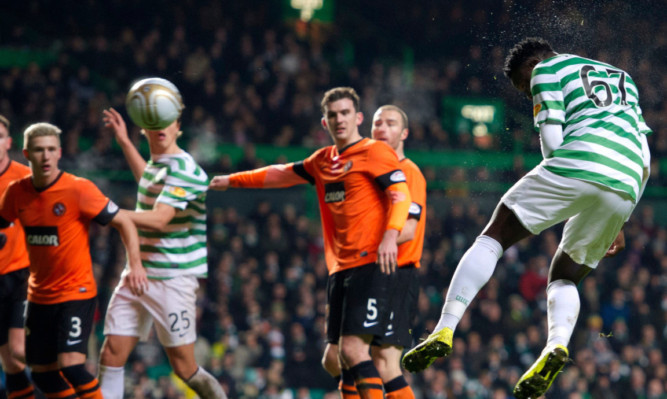 United defenders can only look on as Celtics Victor Wanyama rises unmarked to head home the SPL leaders' second goal.