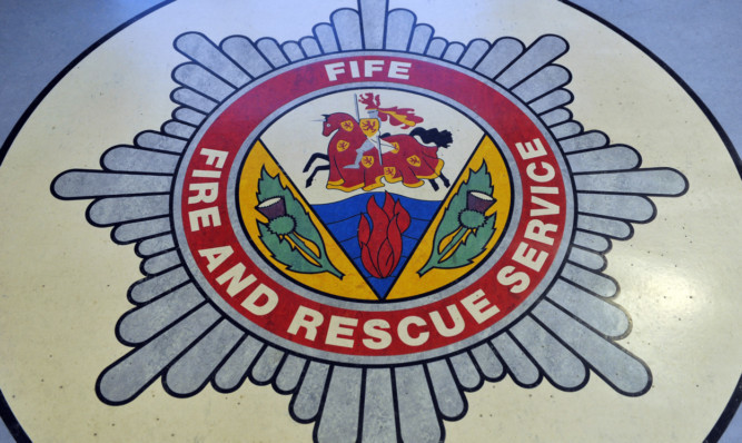 Kim Cessford - 06.11.12 - FOR FILE - pictured is the Fife Fire and Rescue Service badge in the floor at the entrance to the service HQ in Thornton