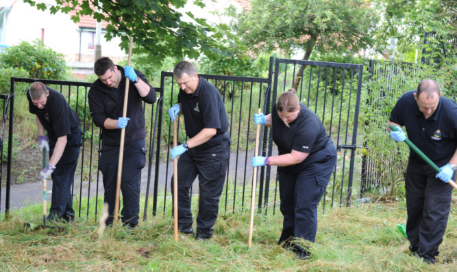 Police investigating near the scene earlier in the murder inquiry.