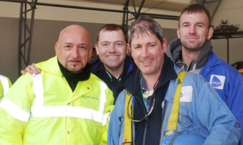 Sir Ben Kingsley meets workers at the dockyard.