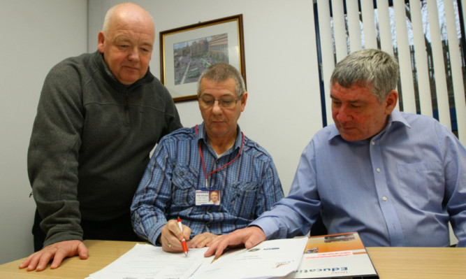 Graeme Stephen, chairman of the Dundee Taxi Association, with UNITE Union and Taxi Branch secretary Chris Elder (left) and Pat Egan (right).