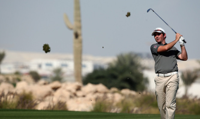 Fifer Peter Whiteford on his way to a first round 66 in Doha.