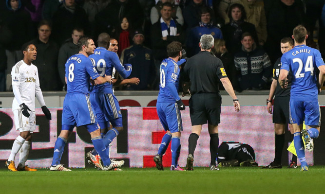 The ball boy lies on the ground after the incident.