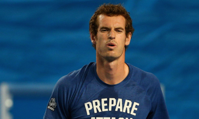 Andy Murray works hard on the training court ahead of his match with Roger Federer.