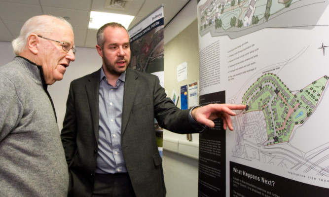 Ewan McIntyre of EMA Architects (right) speaks to Bill Armstrong of Earn Community Council about the plans at the exhibition in Glenearn Community Campus in Perth.