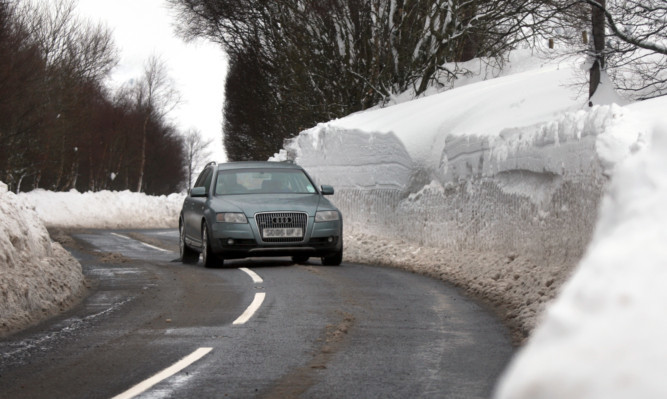 Deep snow drifts on the A93 south of the Spittal of Glenshee.