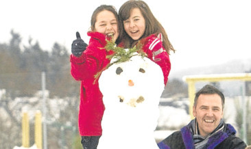 Student and Staff at Pitlochry Primary School build a snowman