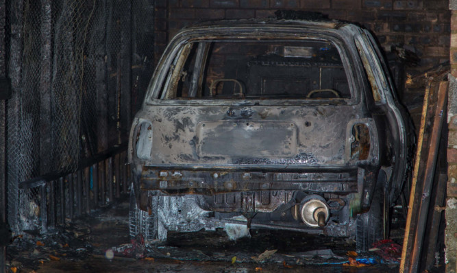 One of the cars damaged in last week's Sinclair Avenue attack.