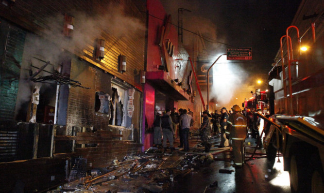 Firefighters at the scene of the disaster.