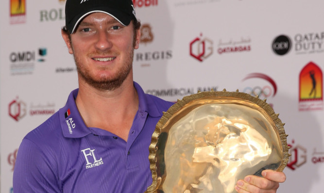 Chris Wood with the winner's trophy.