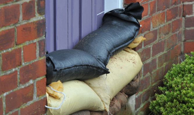 Sandbags protecting a house in Stonehaven after recent flooding.