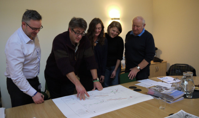 From left: Stirling Council road safety engineer Stuart Geddes, councillor Martin Earl, Parent Council members Mairi McIntosh and Kerry Donaldson and James Innes looking at the plans for the crossing.