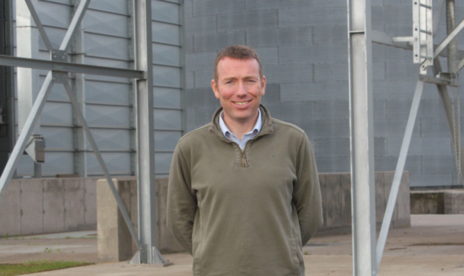 Robin Barron in front of the new barley intake at EOSF.