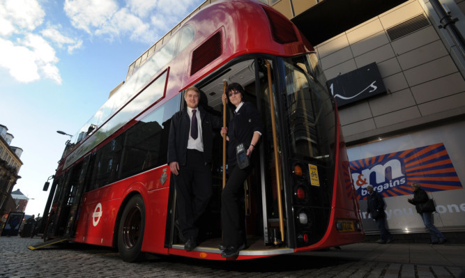 Operations supervisor Aaron McGill and conductor Issy Davidson showing the new bus in Dundee.