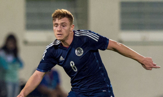 Lewis Macleod in action for Scotland Under 21s
