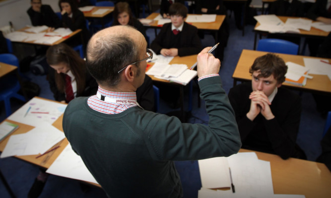 Teacher during a History lesson at Pittville High School, Cheltenham
February 8 2012.
PA Photo : David Davies.